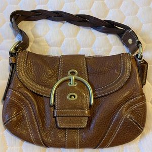 Coach small saddle colored buckle bag